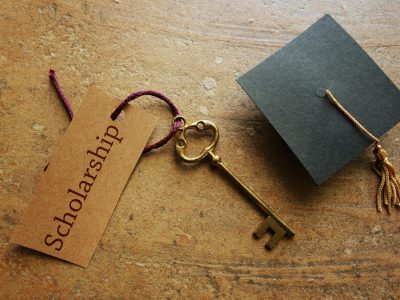Gold key with Scholarship tag, with graduation cap
